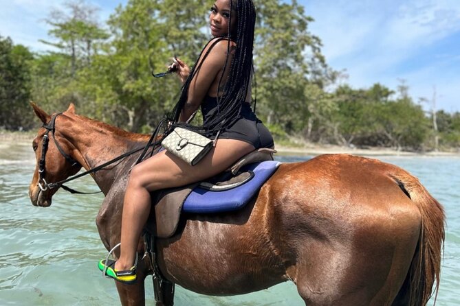 ATV , Bamboo Rafting & Horseback Ride Tour From Montego Bay - Stop 3: St. Ann’s Bay horseback riding, jungle trail, and a sea swim
