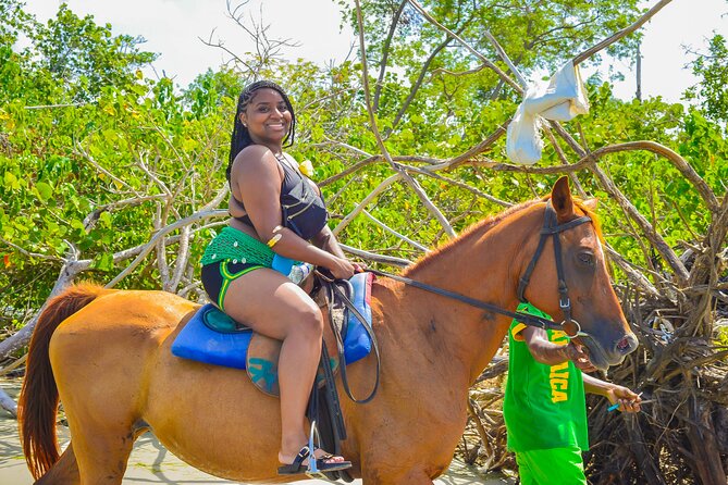 Bamboo Rafting and Horseback Riding Tour Montego Bay Jamaica - Limestone massage and live entertainment during the ride