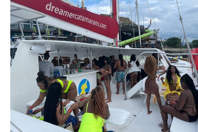 Bamboo Rafting, Catamaran Party Cruise and Snorkeling in Jamaica - Ricks Cafe sunset stop, your photo moment with a payoff