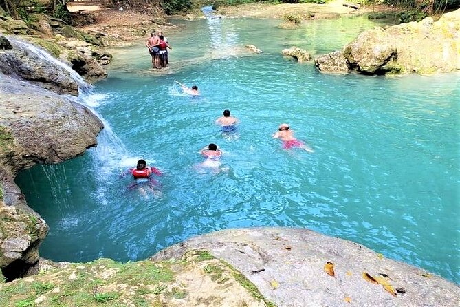 Blue Hole & Secret Falls Day-Trip with Shopping from Grand Palladium - Cool Blue Hole: jumps, rope swings, and swimming in mineral water
