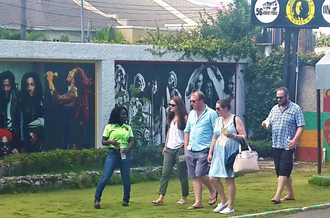Bob Marley Museum Admission & Tour from Ocho Rios - Exhibition Hall highlights: trophies, records, and the One Love Peace hologram