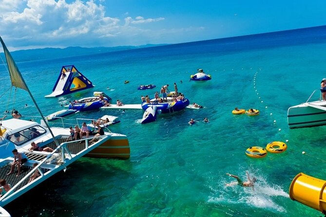 Catamaran Party Cruise and Snorkeling from Montego Bay - Stop at the Doctor’s Cave Beach reef: calm-water snorkeling with gear included