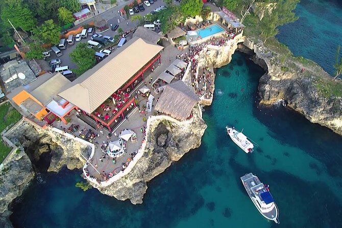 Experience Negril Seven Mile Beach & Jamaica's Famous Ricks Café - Rick’s Cafe Sunset Show: Reggae, Cocktails, and Cliff-Jumping Energy