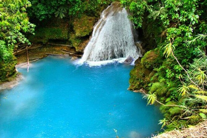 "Explore Scenic Tropical Waterfalls at Blue Hole" - Adventure options: rock jumping and the active side of Blue Hole