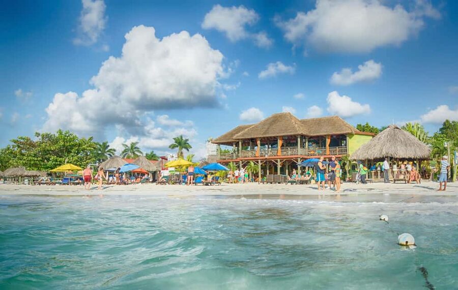 From Montego Bay: Negril Beach & Rick's Cafe Sunset Day Trip - Margaritaville beach stop: easy fun with room to choose