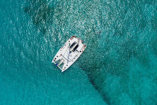 Jamwest Beach Negril Family Catamaran Cruise Pick up from Lucea - Rick’s Cafe for sunset: cliff jumpers, big views, and how long you have there