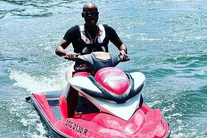 Jet Ski/ Parasailig Water Activity in Montego Bay Jamaica. - Your Jet Ski Ride: Speed, Control, and Coastline Views