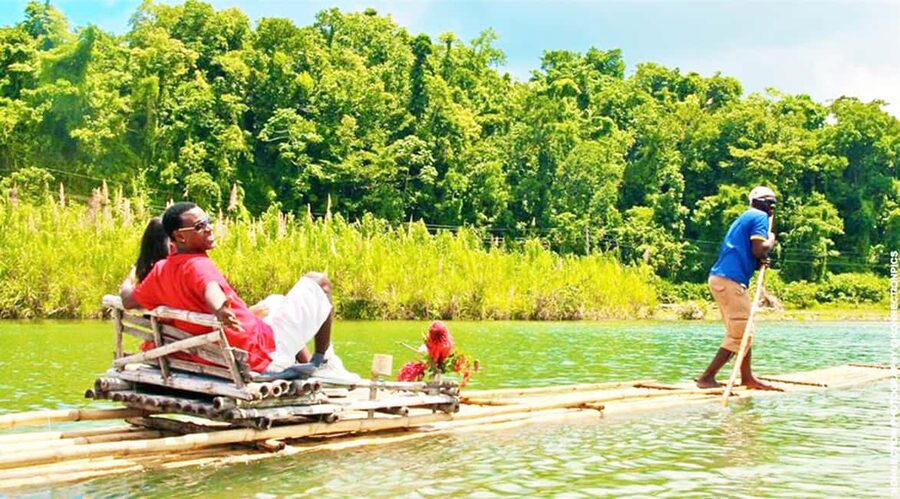 Martha Brae River Rafting Private trip - Getting on the 30-foot bamboo raft for your guided drift