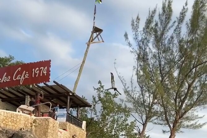 Negril 7 mile Beach, Party Catamaran Cruise , Snorkeling and Ricks Cafe Combo - Rick’s Cafe at Sunset: Cliff Jumping Energy Without the Guesswork
