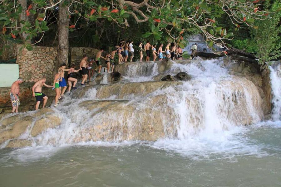 Ocho Rios: Dunn’s River Falls & Reggae Hill Tour - Reggae Hill by the White River: swim time, chairs, and easy entertainment