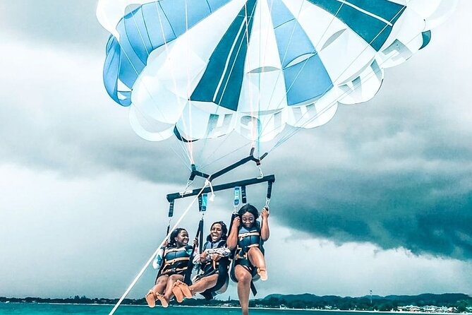 Parasailing, Blue Hole Mineral Spring, Seven Mile Beach - Blue Hole Mineral Spring, pools, and that 55 ft spectacle