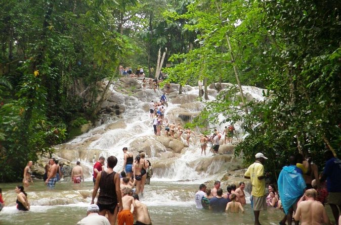 [PRIVATE]Dunn's River & Martha Brae Rafting - Entrance & Lunch - Stop 2: Dunn’s River Falls and the park, with a guide leading the way