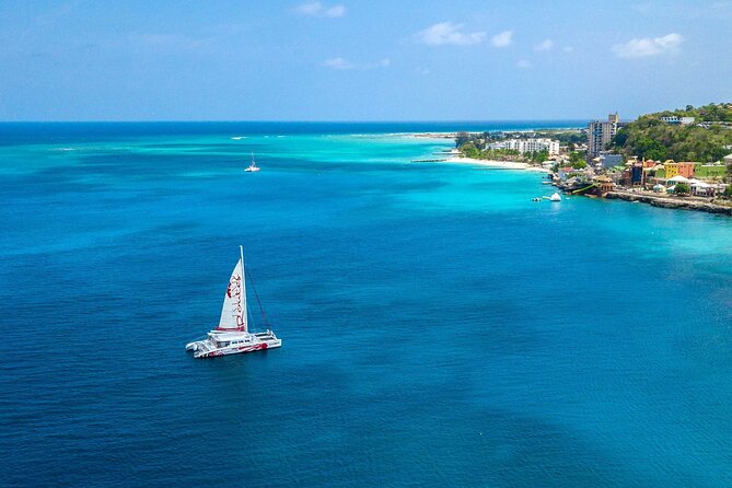 Reggae Catamaran and Snorkeling Open Bar Cruise Montego Bay - Tropical Bliss Beach stop: meet at the dock, then the cruise begins
