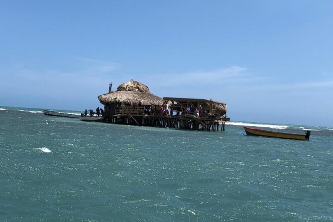 Tour to Black River and YS Falls - Stop 3 at Floyd’s Pelican Bar: a short ocean boat ride and a one-of-a-kind setting