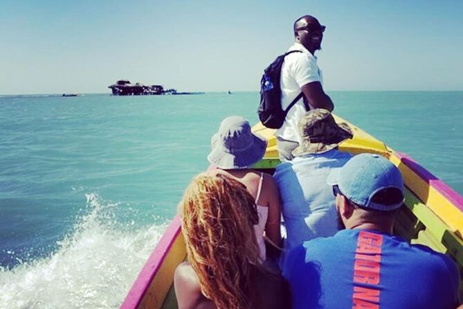 YS Falls, Black River Safari, Appleton Rum Tour OR Pelican Bar (Choose Up to 3) - Floyd’s Pelican Bar: driftwood, shallow water, and a bar that feels like a story